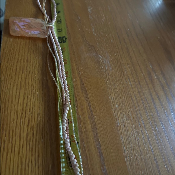 Necklace cute four bead strands 21” with plastic 2” pendant in soft peach color. - Picture 5 of 7